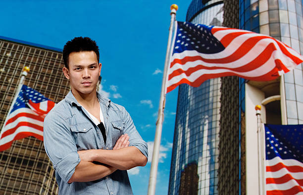 istock Young man standing with arms crossed 187047151