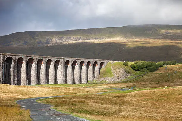 A close view of Ribblehead Viaduct with Whernside in the background, Yorkshire Dales National Park, North Yorkshire, England.