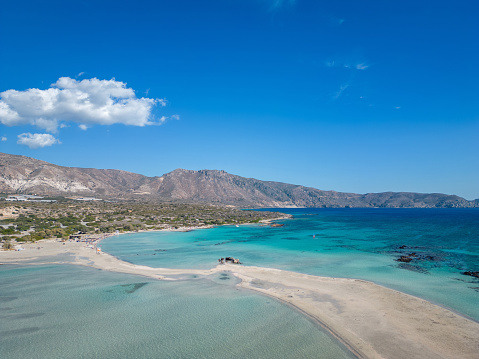 Elafonisi beach in Crete, Greece. Panorama of the crystal clear sea water and amazing beach with blue sky during summer.