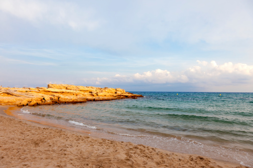 Calafat sand beach near the resort town of Ametlla de Mar on the Costa Dorada in the province of Tarragona, Catalonia, Spain.