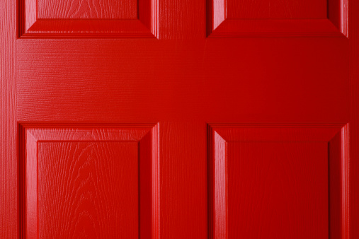 Close up of a red front door.