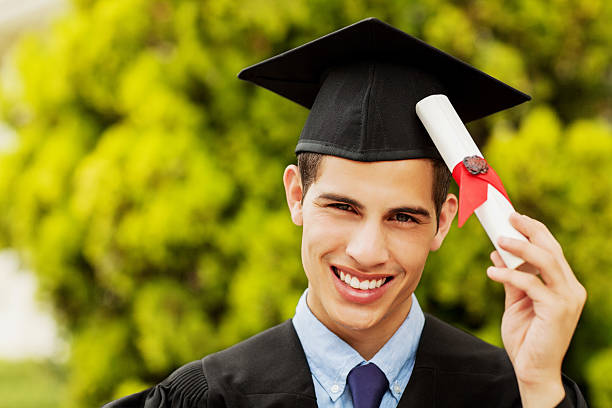 istock Confident Student Showing Diploma On Graduation Day At Campus 187048530