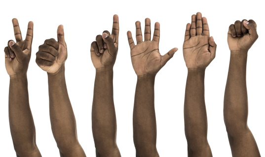 African descent man doing hand gestures on white background