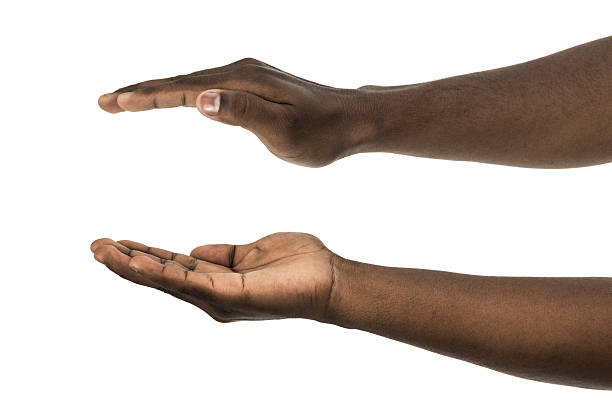 African descent man with palms facing up and down African descent man with palms facing up and down on white background hand palm stock pictures, royalty-free photos & images