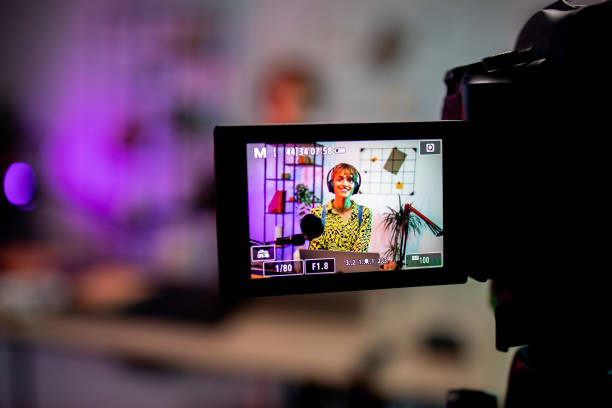 istock Camera recording a girl while podcasting 1870491559