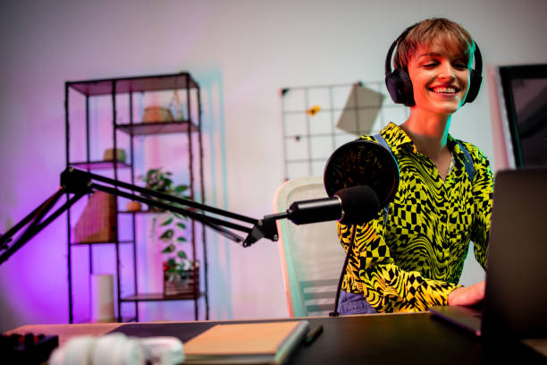 istock Beautiful, young journalist podcasting at her home studio 1870491562