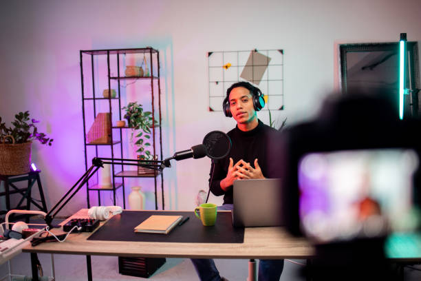 istock Young man recording a live podcast at his studio 1870491566