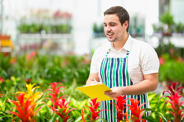 istock Male Florist Working At Garden Center. 187049304