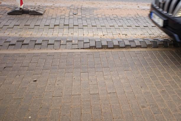 istock Defect in the road surface of artificial paving stones. Damage to the road surface. 1870496475