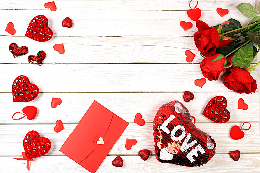 Concept for Valentine's Day or Women's Day, Mother's Day, banner. Greeting card, roses, hearts and gift boxes on a wooden background, happy holiday, birthday greetings, selective focus