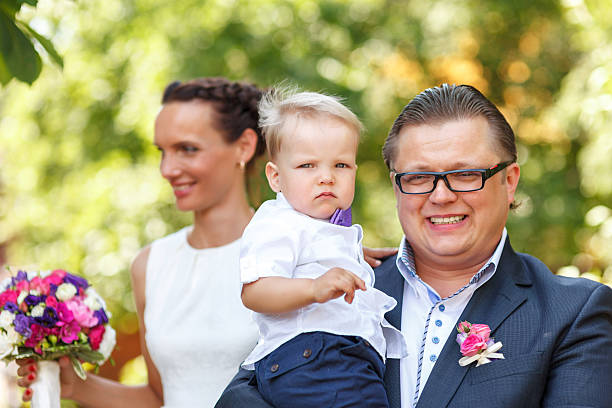istock Happy Newlyweds with their son 187051039