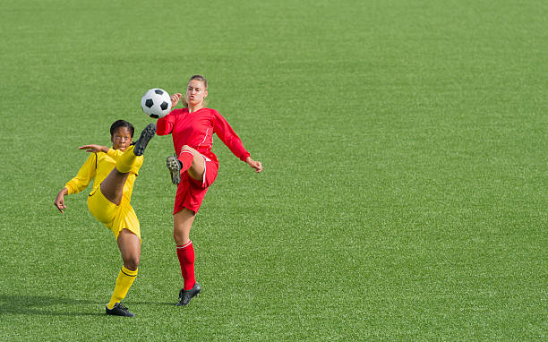 istock Young Women Playing Football 187051222