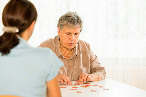 Therapy: Senior woman with puzzle
