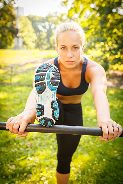istock Woman Stretching Outdoors 187051943
