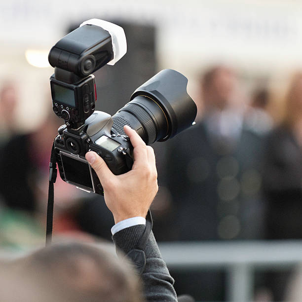 istock Photographer in the crowd 187052627