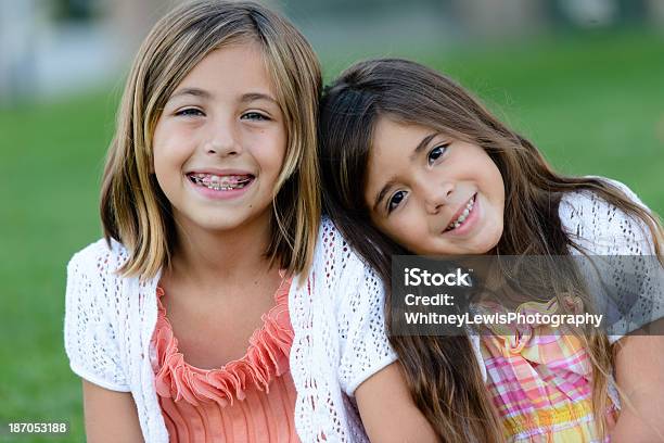 Happy Sisters At The Park Stock Photo - Download Image Now - Dental Braces, Child, Smiling