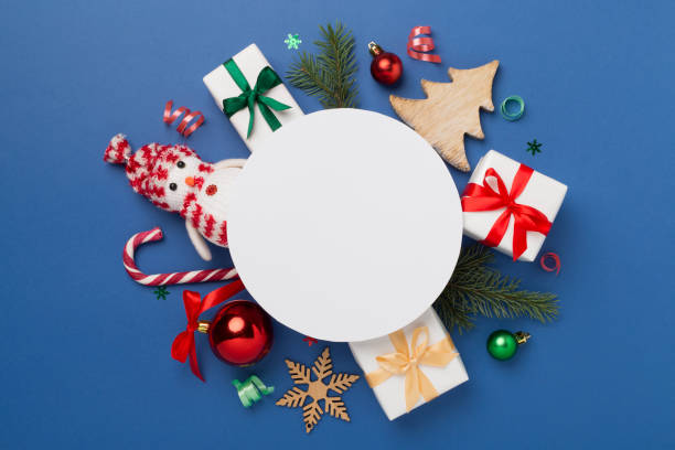 istock Greeting card mockup with christmas decor on color background, top view 1870545504