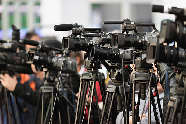 TV cameras TV cameras lined up, covering large public event press conference photos stock pictures, royalty-free photos & images