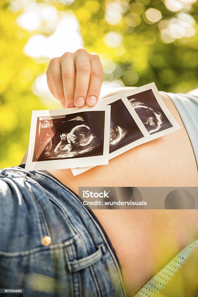 Ultrasound Images Over Pregnant Womans Baby Belly Stock Photo