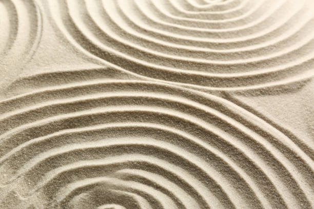 istock Beautiful patterns on sand, closeup. Zen garden 1870557035