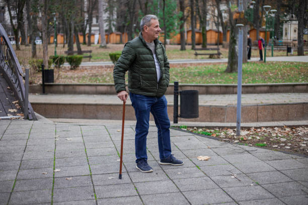 istock A senior man walks in an autumn public park 1870578885