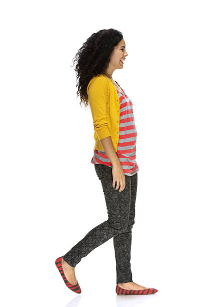 Smiling young woman walking