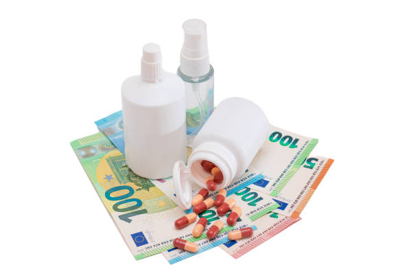 istock Different Bottles with Pills, Capsules and Medicines on the Euro Banknotes 1870586661