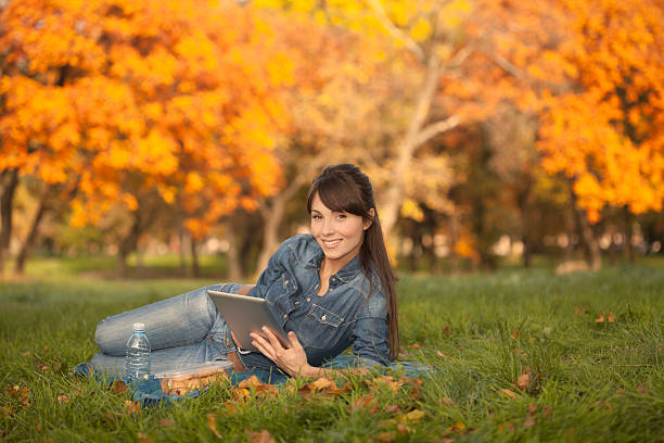 istock Women enjoy in a autumn park. 187060721