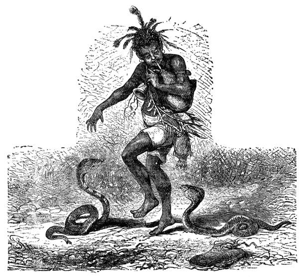 Snake charmer with Egyptian Cobra snakes (naja haje) in Egypt. Vintage etching circa 19th century.