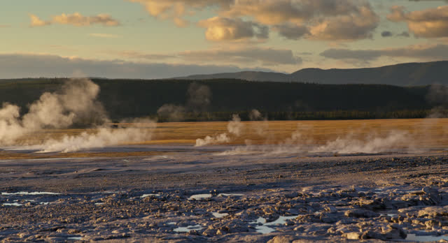 Scenic Wide Shot of Steam Blowing Off Yellowstone National Park Landscape