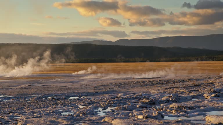 Wide Shot of Steam Blowing off the Ground in Yellowstone National Park on a Fall Sunset