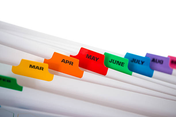 Filing Separators with coloured monthly tabs stock photo