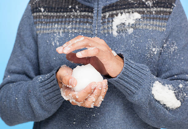 istock Unrecognised man holding snowball. 187063510
