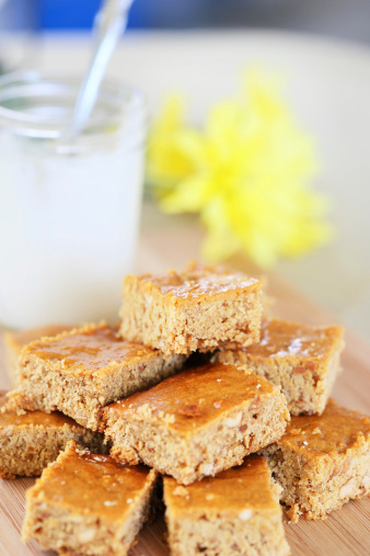 Stack of paenut butter blondies with nuts