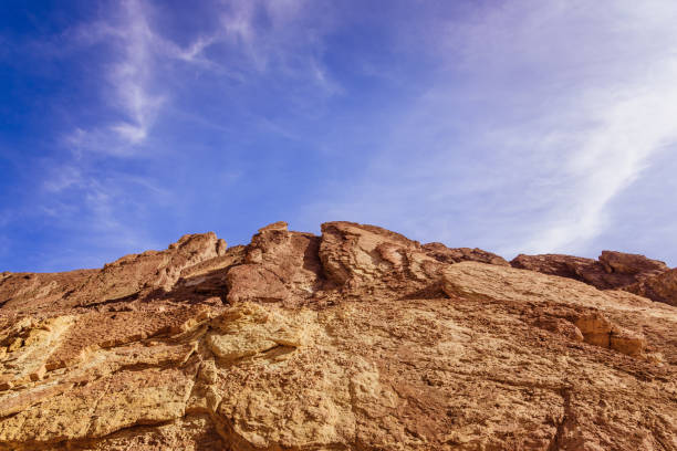 Yellow rock under summer sun and a blue sky