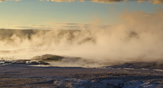 Water Gushing Off of Yellowstone National Park Geysers at Sunset