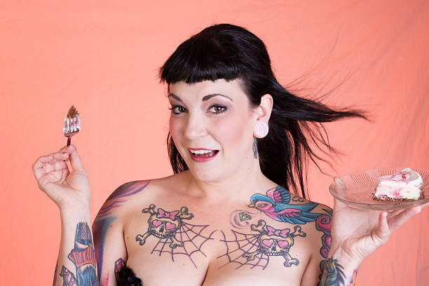 istock Laughing pinup model with hair blowing and cheesecake. 187065656