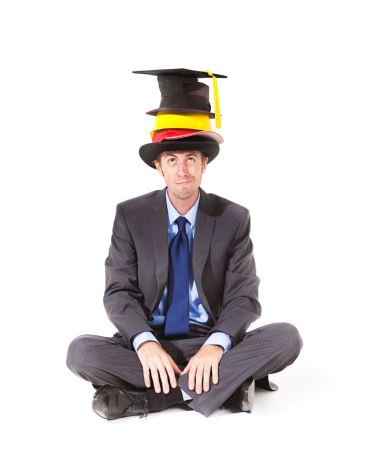 A multi-talented businessman wearing many hats in front of a clock managing time and deadline.