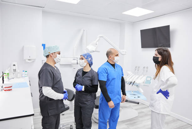 istock Group of dentist talking in clinic 1870661195