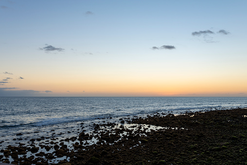 Beautiful sunset view on the beach in Maspalomas city on Gran Canaria island.