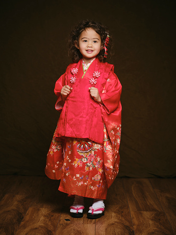 A multiracial Japanese girl wearing a kimono for a shichigosan portrait.