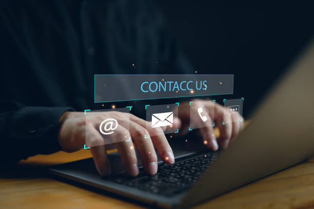 istock Contact us or Customer support hotline, people connect. Businessman show on virtual screen contact icons email, address, live chat, telephone. Customer service, helpdesk advice online support 1870664424