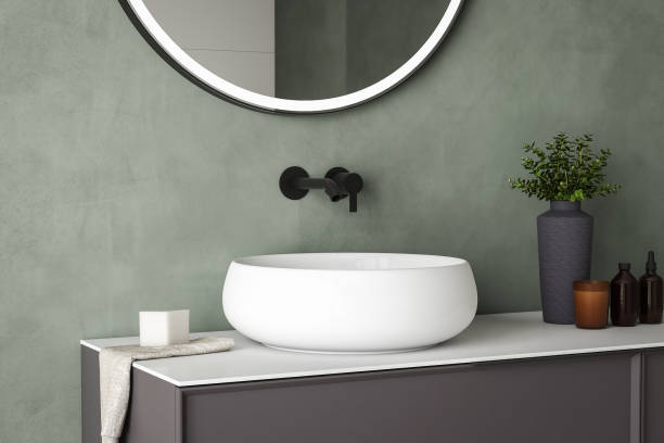istock 3D render close up perspective blank empty space on ceramic vanity unit counter top in the bathroom with white ceramic porcelain sink with faucet, morning sunlight, wall, Elegance 1870665495