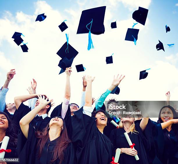 Graduation Caps Thrown In The Air Stock Photo - Download Image Now - Graduation, Throwing, Mortarboard