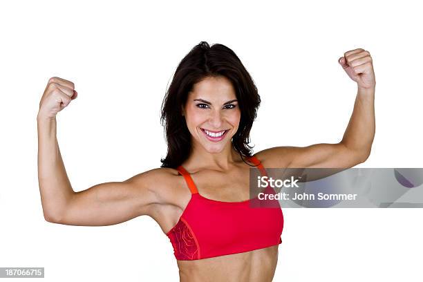 Mujer Flexionar Los Músculos Foto de stock y más banco de imágenes de 20 a 29 años - 20 a 29 años, 20-24 años, Adulto