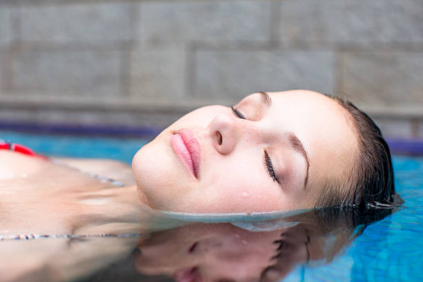 istock Beautiful young woman in a spa pool 187067123