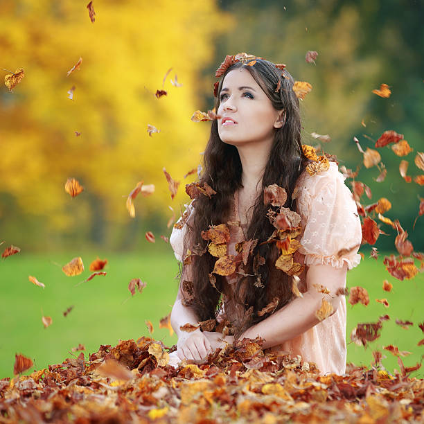 istock Beautiful woman in autumn park 187067444