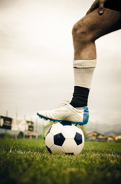 istock Soccer player with foot on a ball 187067699