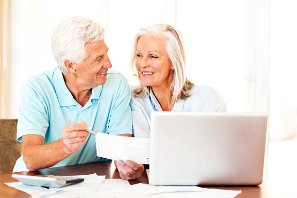 istock Happy Couple Discussing Home Finances 187067746