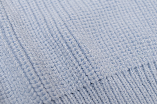 blue knitted crumpled fabric. Warm, soft textile material. copy space